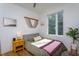 Well-lit bedroom with a comfortable bed, natural light, and simple decor at 414 Chavis Way, Raleigh, NC 27601
