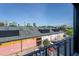 Balcony view overlooking the city skyline and streetscape with parked cars at 414 Chavis Way, Raleigh, NC 27601
