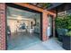 Open garage showcasing tool storage, ample storage, and access to outdoor elements at 414 Chavis Way, Raleigh, NC 27601