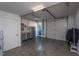 Well-lit garage with storage cabinets, ample space, and both a roll-up and a walk-through door at 414 Chavis Way, Raleigh, NC 27601