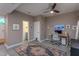 Spacious home office with desk setup, rug, and adjacent bathroom for convenience at 414 Chavis Way, Raleigh, NC 27601
