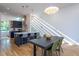 Modern kitchen featuring stainless steel appliances, a center island with bar seating, and stylish pendant lighting at 414 Chavis Way, Raleigh, NC 27601