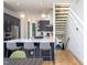 Stylish kitchen boasts navy cabinets, a spacious island with bar seating, and modern lighting fixtures at 414 Chavis Way, Raleigh, NC 27601