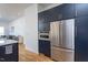 Gourmet kitchen showcases navy cabinetry, stainless steel appliances, and hardwood floors at 414 Chavis Way, Raleigh, NC 27601