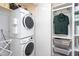 Functional laundry area with stacked washer/dryer and convenient closet organization system at 414 Chavis Way, Raleigh, NC 27601