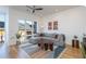 Bright living room features a large window, comfortable sectional, and stylish decor at 414 Chavis Way, Raleigh, NC 27601