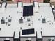 A rooftop view showcases solar panels and HVAC units, highlighting energy efficiency and modern technology at 414 Chavis Way, Raleigh, NC 27601