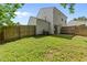 Fenced backyard with an air conditioning unit and sliding door entry to home at 4221 Ivy Hill Rd, Raleigh, NC 27616