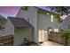 Backyard featuring white siding, fenced perimeter, and a sliding glass door entrance at 4221 Ivy Hill Rd, Raleigh, NC 27616