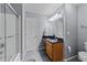 Bathroom with granite vanity, tile floors, and walk-in shower at 4221 Ivy Hill Rd, Raleigh, NC 27616