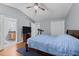 Comfortable bedroom with vaulted ceiling, hardwood floors, ceiling fan and en suite bath at 4221 Ivy Hill Rd, Raleigh, NC 27616
