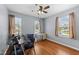 Office/bedroom with wood floors, ceiling fan, and two windows providing natural light at 4221 Ivy Hill Rd, Raleigh, NC 27616