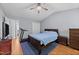 Comfortable bedroom with vaulted ceiling, hardwood floors, and ceiling fan at 4221 Ivy Hill Rd, Raleigh, NC 27616