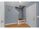 Entryway featuring hardwood floors, stairs leading to upper level, and a white front door at 4221 Ivy Hill Rd, Raleigh, NC 27616