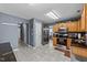 Updated kitchen featuring stainless steel appliances, black countertops, and tiled flooring at 4221 Ivy Hill Rd, Raleigh, NC 27616