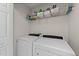 Laundry room with washer, dryer and white wire shelving for storage at 4221 Ivy Hill Rd, Raleigh, NC 27616
