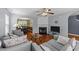 Inviting living room with hardwood floors, fireplace, and open view to the dining area at 4221 Ivy Hill Rd, Raleigh, NC 27616