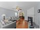 Comfortable living space offering a fireplace, and an open layout to the dining area at 4221 Ivy Hill Rd, Raleigh, NC 27616