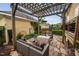 Inviting backyard patio featuring a pergola, comfortable seating, and serene outdoor living space at 4409 All Points View Way, Raleigh, NC 27614