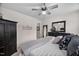 Spacious bedroom with a large bed, dresser, ceiling fan, and neutral color palette at 4409 All Points View Way, Raleigh, NC 27614