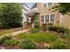 Charming two-story home featuring a welcoming front porch and beautifully landscaped front yard at 4409 All Points View Way, Raleigh, NC 27614
