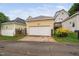 Detached garage with white door and a well-maintained driveway at 4409 All Points View Way, Raleigh, NC 27614