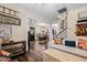 Cozy living room with hardwood floors and open layout to the dining room and kitchen at 4409 All Points View Way, Raleigh, NC 27614