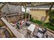 Inviting patio area with stone flooring, comfortable seating under a pergola, and a charming backyard fence at 4409 All Points View Way, Raleigh, NC 27614