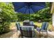 A backyard patio that features an outdoor dining area with seating for relaxing and entertainment at 4508 Alice Dr, Oxford, NC 27565