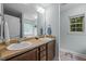 Bright bathroom featuring a double sink vanity, large mirror, and plenty of counter space at 4508 Alice Dr, Oxford, NC 27565