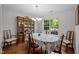 Dining room with wood table and chairs, chandelier, wood floors and china cabinet at 4508 Alice Dr, Oxford, NC 27565