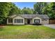 Charming single-Gathering home with well-manicured lawn, inviting entrance, and attached garage at 4508 Alice Dr, Oxford, NC 27565