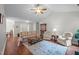 Comfortable living room showcasing an open layout, vaulted ceiling and wood flooring at 4508 Alice Dr, Oxford, NC 27565