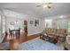 Inviting living room with wood floors, dining area, and open floor plan at 4508 Alice Dr, Oxford, NC 27565