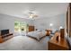 Spacious main bedroom suite with large windows, ceiling fan, and ample natural light at 4508 Alice Dr, Oxford, NC 27565