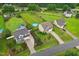 Aerial view of homes with big yards, long driveways, mature trees and pools, set in a peaceful neighborhood at 50 Consella Way, Franklinton, NC 27525