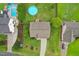 Aerial view of property showcasing the backyard with pool and manicured lawn at 50 Consella Way, Franklinton, NC 27525