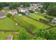 Lush, green neighborhood features a swimming pool and well-maintained lawns in a Gathering-friendly community at 50 Consella Way, Franklinton, NC 27525