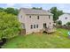 Two-story home with a deck, fenced yard, and well-maintained landscaping, ideal for outdoor living at 50 Consella Way, Franklinton, NC 27525