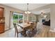 Dining area with sliding glass doors and views of the backyard and an adjacent living room at 50 Consella Way, Franklinton, NC 27525
