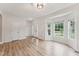 Bright entryway featuring wood floors, a bay window, and a welcoming front door at 50 Consella Way, Franklinton, NC 27525