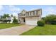 Two-story home with an attached garage, well-maintained lawn, and landscaping at 50 Consella Way, Franklinton, NC 27525
