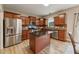 Spacious kitchen with stainless steel appliances, dark countertops, and a kitchen island at 50 Consella Way, Franklinton, NC 27525