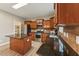 Kitchen featuring granite counters, stainless steel appliances, island and wood cabinets at 50 Consella Way, Franklinton, NC 27525