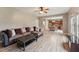 Open-concept living room with wood-look floors and an open view into dining area and kitchen at 50 Consella Way, Franklinton, NC 27525