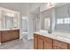 Bright bathroom features double vanity sinks with sleek fixtures and a separate shower stall at 5025 Stonewood Pines Dr, Knightdale, NC 27545