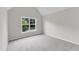 Inviting bedroom featuring a bright window and plush carpeting at 5025 Stonewood Pines Dr, Knightdale, NC 27545