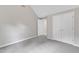 A bright bedroom offers plush carpets and a closet at 5025 Stonewood Pines Dr, Knightdale, NC 27545