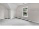 Bright closet with white shelves and a window looking onto trees at 5025 Stonewood Pines Dr, Knightdale, NC 27545