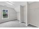 Spacious walk-in closet with ample shelving and a view to an outside yard at 5025 Stonewood Pines Dr, Knightdale, NC 27545